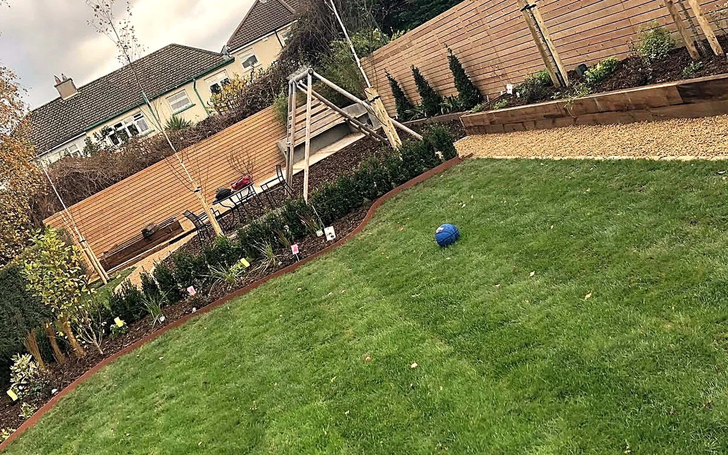Landscaped garden with lawn and timber fencing