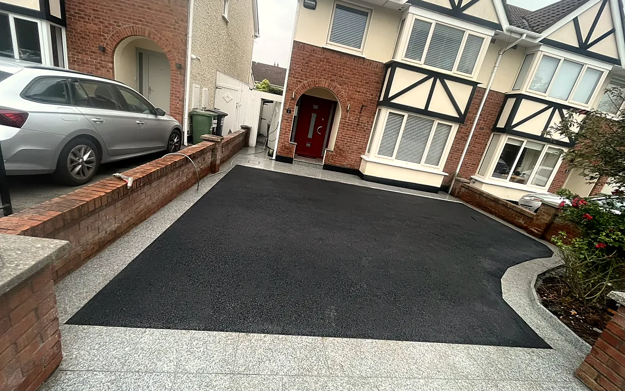 A machine-laid tarmac driveway in South Dublin, laid to falls over a compacted stone base.