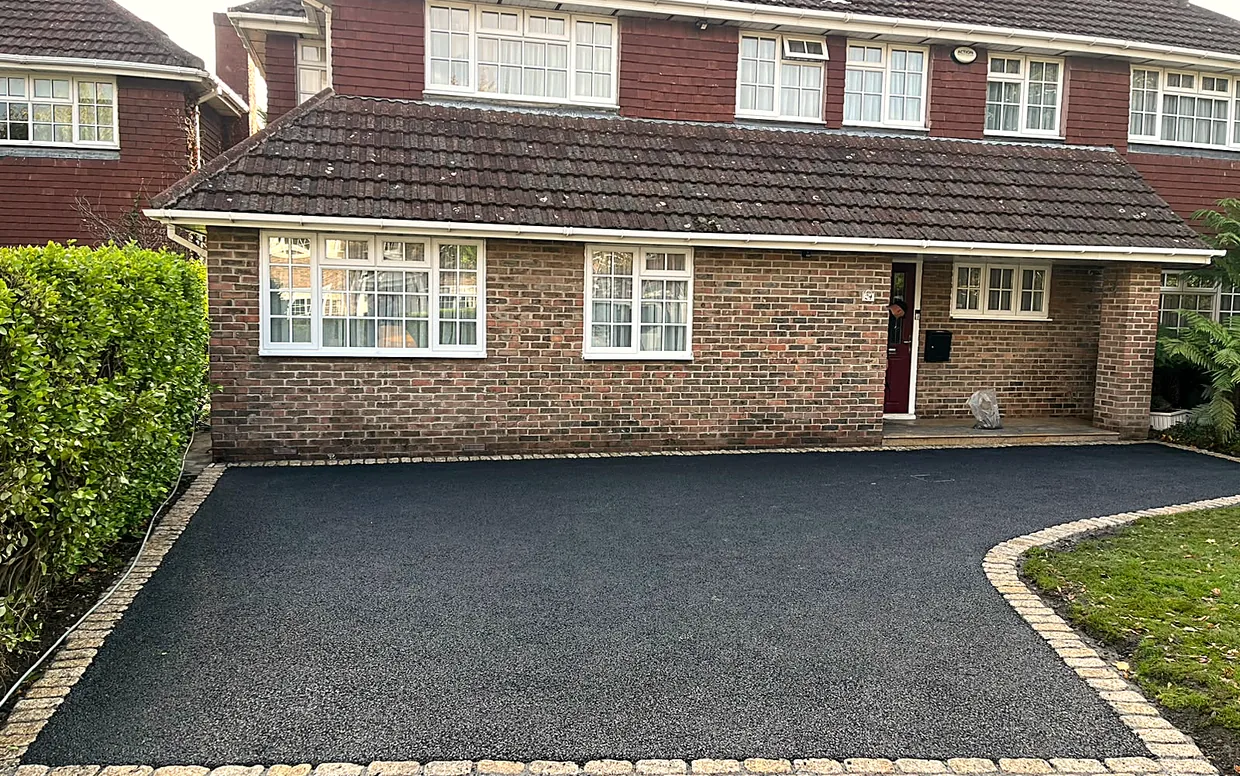 A new tarmac driveway laid to falls on a freshly compacted base in South Dublin.