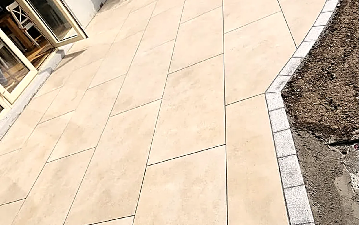 A porcelain patio laid on a full bound bed, the kind of finish to look for.