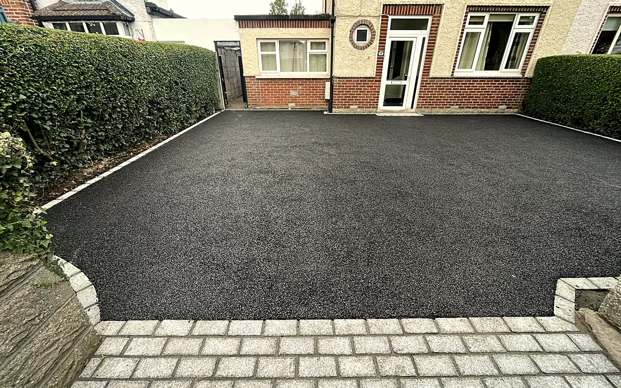 Machine-laid tarmac, the hard-wearing all-rounder, edged in granite.