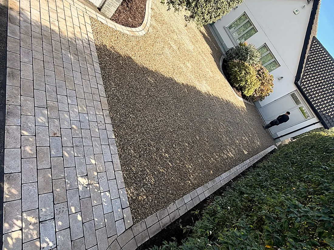 The gravel driveway in Foxrock from the gate: the limestone cobble apron, then gravel up to the bungalow