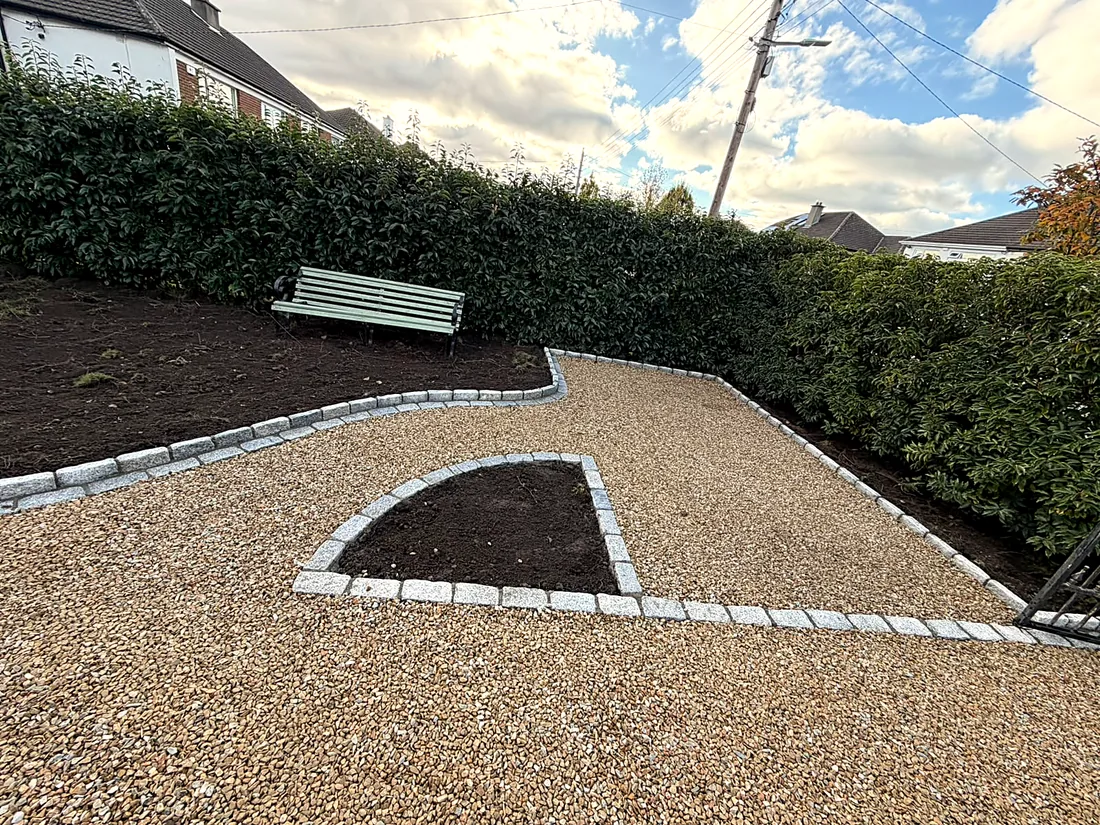 The finished gravel driveway in Leopardstown, the granite-edged bed and a bench by the hedge