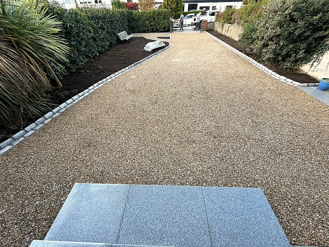 The gravel drive from the house towards the gate, granite edging on both sides