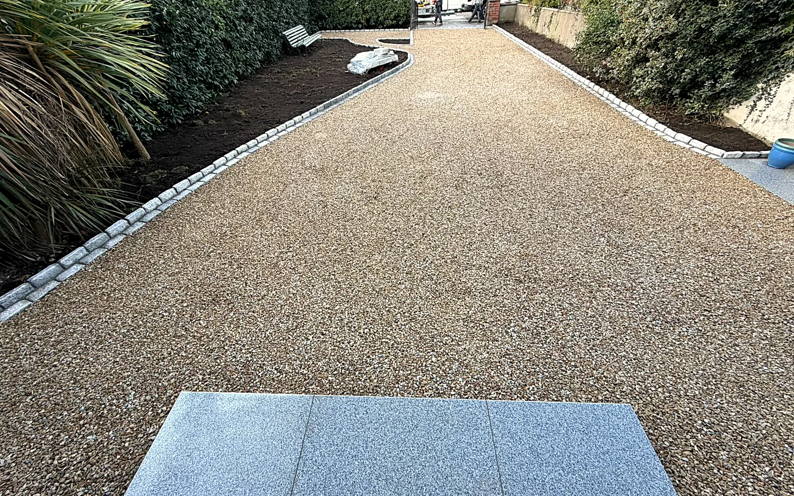 The gravel drive from the house towards the gate, granite edging on both sides - after