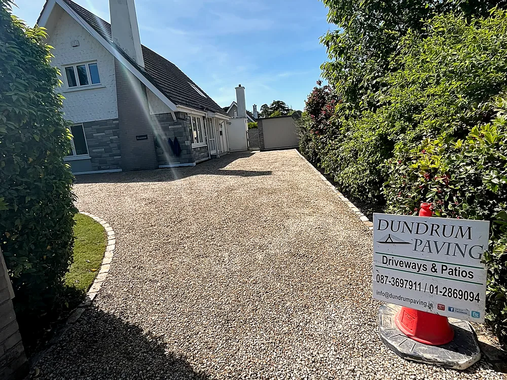 Cobble entrance with granite pillars