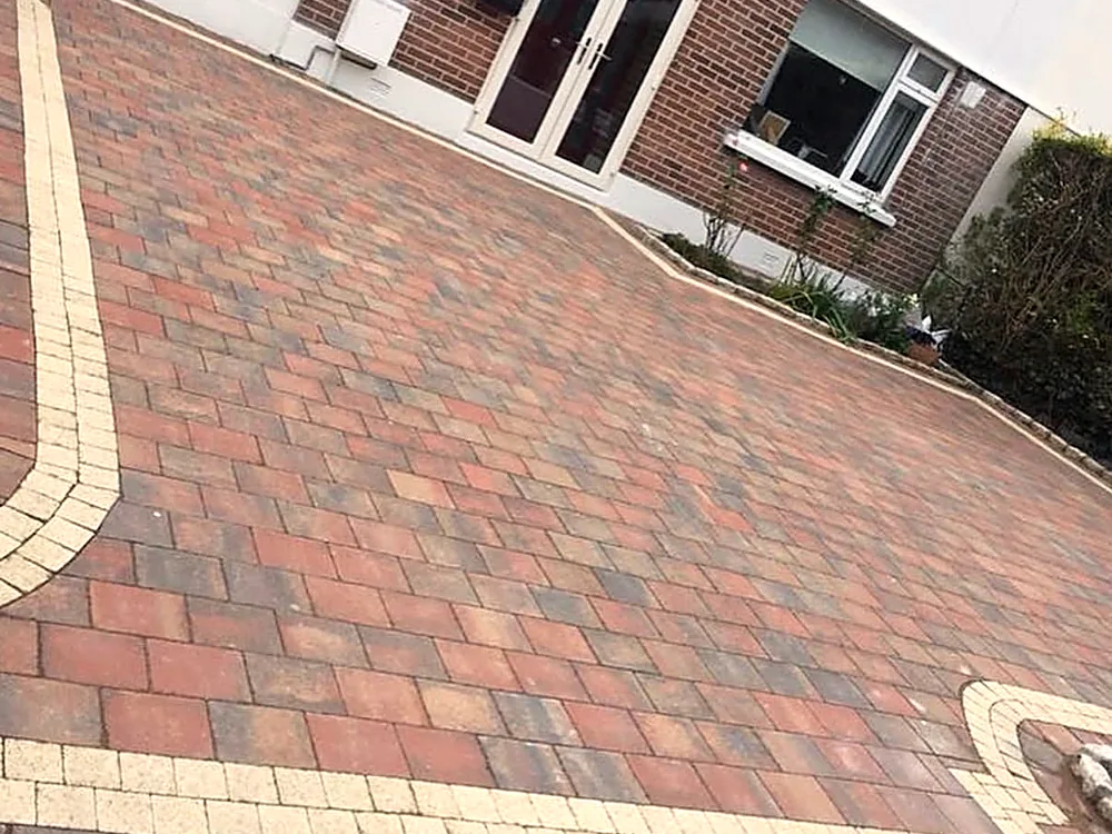 Red brick paving with a decorative border