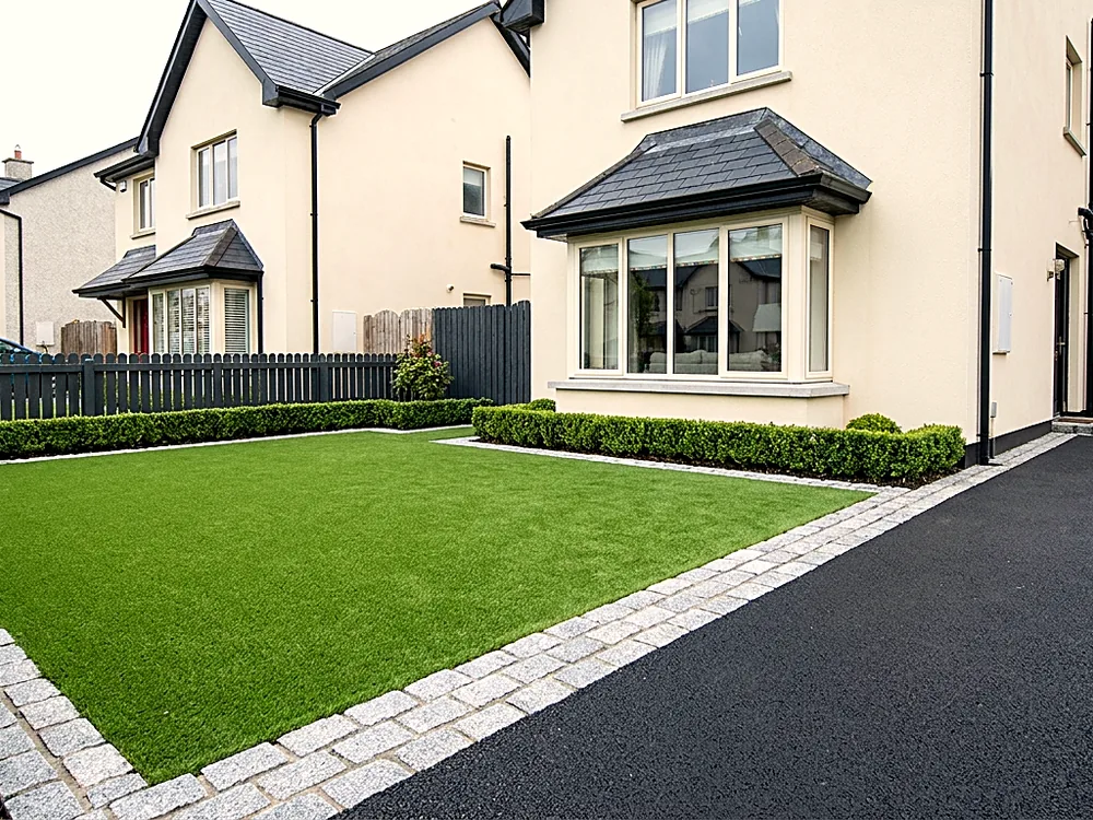 Front garden artificial grass with granite cobble edging