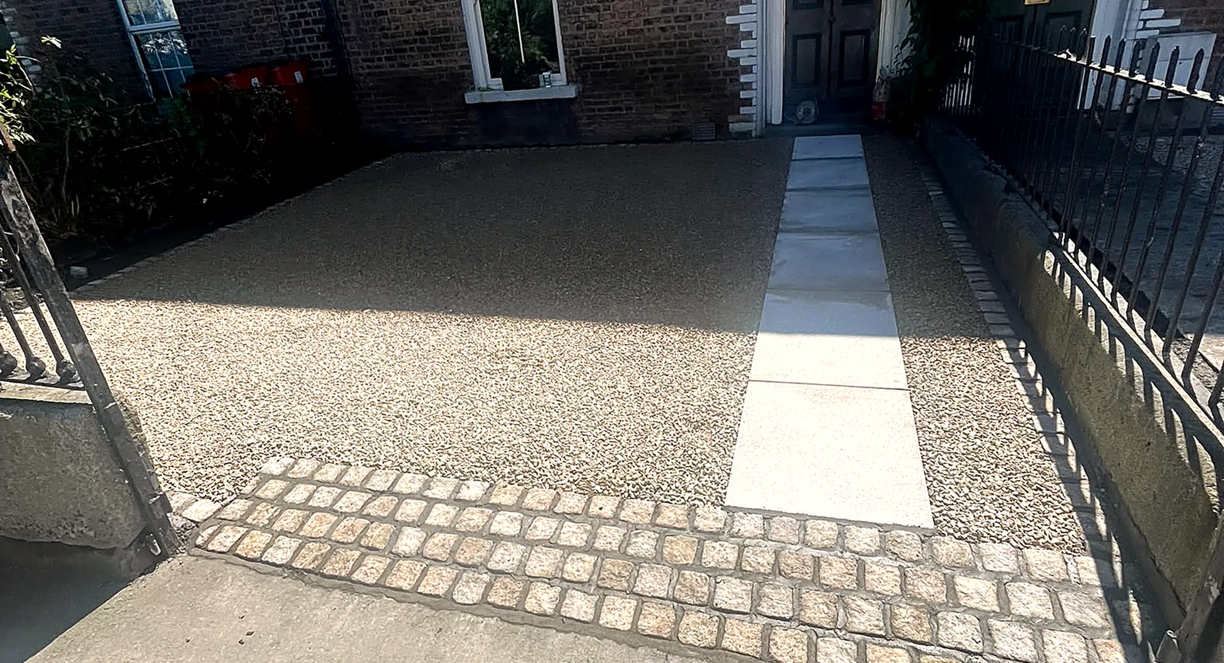 Block paved driveway with a granite centre strip