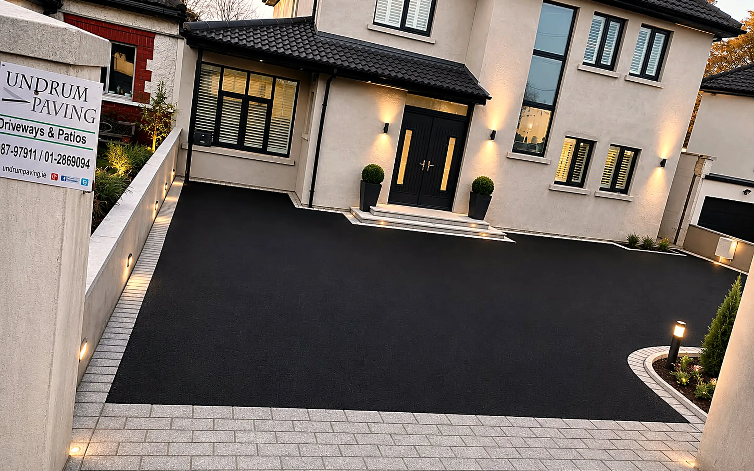 Machine-laid tarmac driveway with granite cobble apron